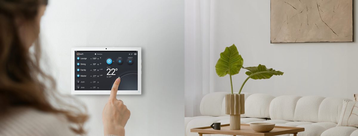 AirTouch 5 wall touchscreen panel being used in a modern Melbourne living room